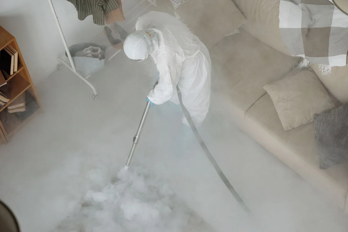 Biohazard cleanup technician in protective equipment, Pflugerville, TX